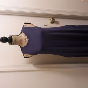 A sleeveless knit dress with pockets